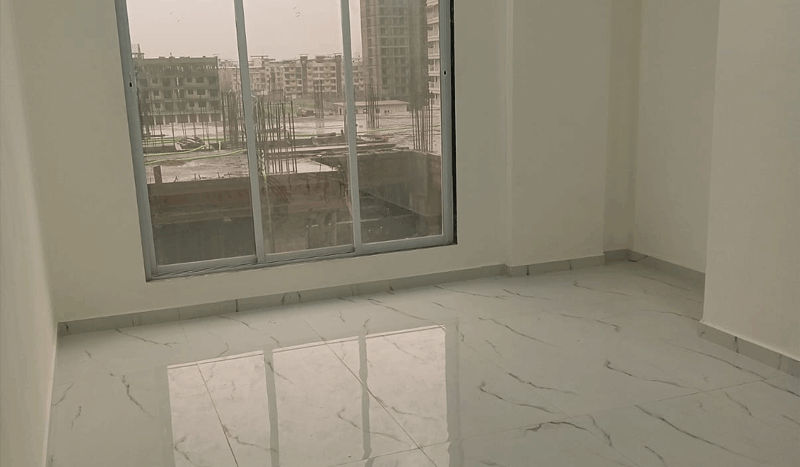 Modern 1BHK flat interior for sale at Tirumala Estate, Kasheli Thane – 615 Sq. Ft. with stylish living room, bedroom, and kitchen